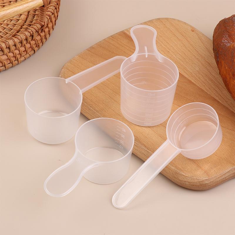 10 ks 15/25/30/35g Průhledná plastová lžička na sušené mléko s odměrkou v ml Kuchyňská pečicí odměrka