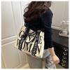 2025 Women's Color-Blocking Canvas Handbag: Trendy Crossbody & Shoulder Bag with Colorful Strap