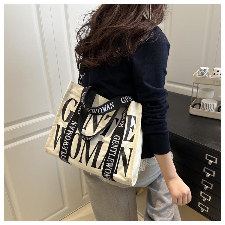 2025 Women's Color-Blocking Canvas Handbag: Trendy Crossbody & Shoulder Bag with Colorful Strap