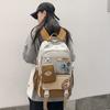Stylish and Exquisite Contrasting Color Badge Large-capacity Backpack 24 New Primary School Junior High School Boys and Girls Schoolbag