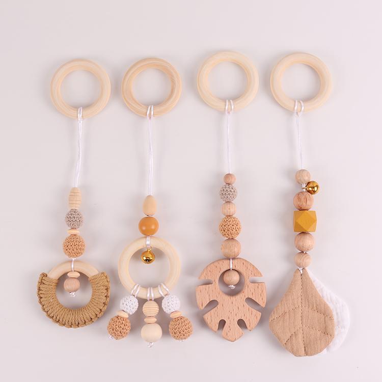 China Manufacturer Exquisite Color Leaf Four-piece Fitness Rack Pendant Wooden Baby Play Activity Gym