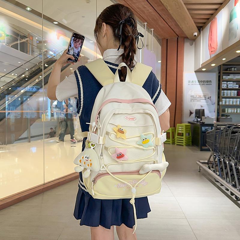 High-value cute primary school student spine care schoolbag female junior high school girl high school student backpack burden reduction