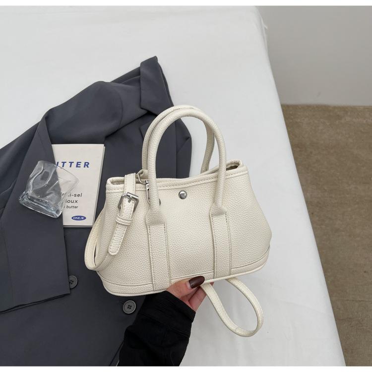 2025 New Niche Simple Leisure Commuter Portable Bucket Bag Versatile Solid Color Child and Mother Bag Messenger Bag Bag