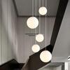 Minimalist Rotating Stair Chandelier: Irregular Long Duplex Pendant with Large Round Ball in Cream