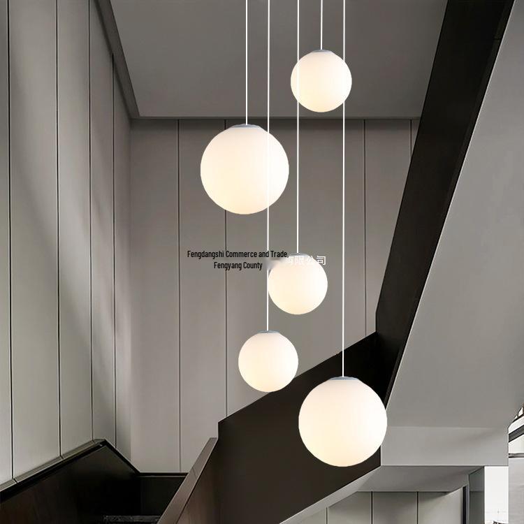 Minimalist Rotating Stair Chandelier: Irregular Long Duplex Pendant with Large Round Ball in Cream