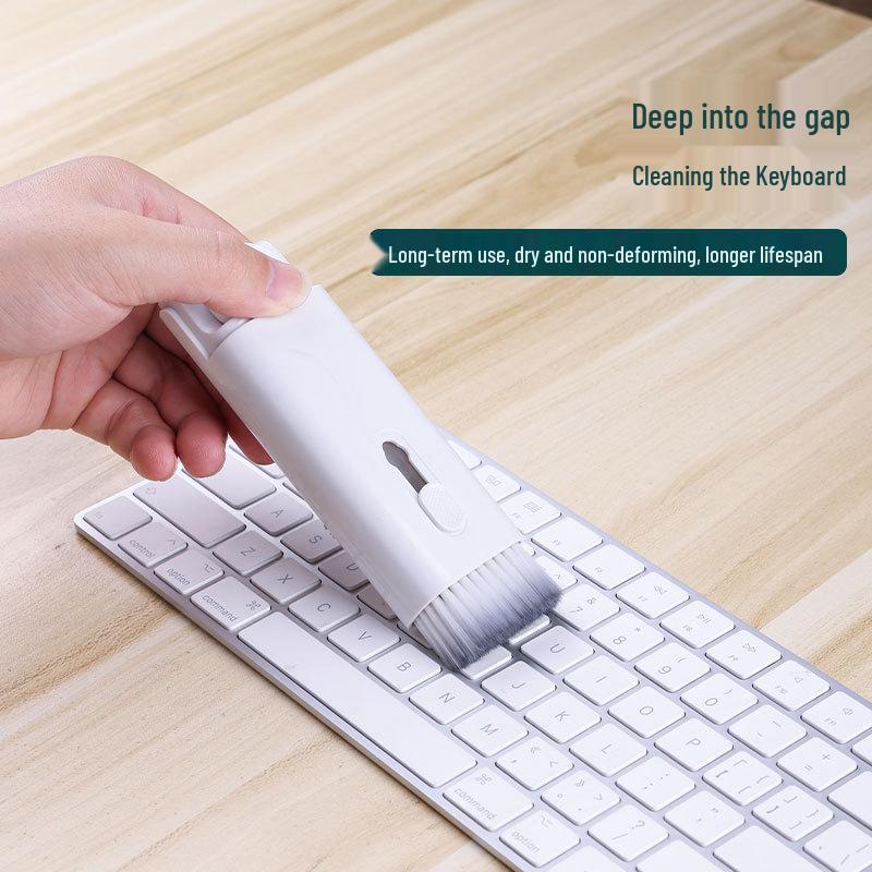 Q6E7 7-in-1 Multifunctional Cleaning Tool Set: Keyboard, Earphone, and Phone Dust Remover.