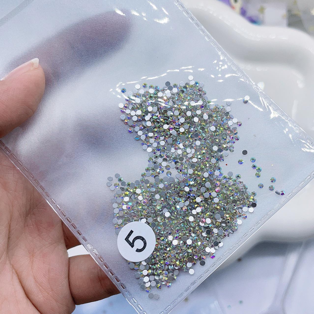 

1440 шт. Универсальные стразы AB цвета с плоской задней стороной для нейл-арта - японский и корейский стиль, маленький круглый дизайн для заполнения промежутков About 1440 pieces per bag