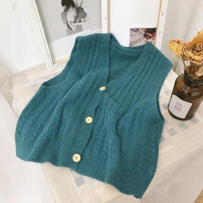 Knitted Vest, Short Top, Sleeveless Sweater Worn On Top A Small Woman with A Cardigan and A Camisole Shoulder