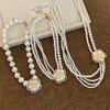 Diamond-encrusted flower multi-layer pearl necklace French retro temperament versatile collarbone chain light luxury high-end sweater chain women