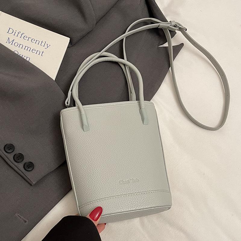 This year's popular niche simple dopamine lychee pattern portable bucket bag women's versatile casual messenger mobile phone bag