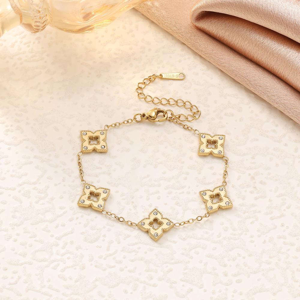 Elegant Titanium Steel Clover Jewelry Set - Necklace, Bracelet, and Earrings in Four-Leaf Design with Micro-Inlaid Details for Women.