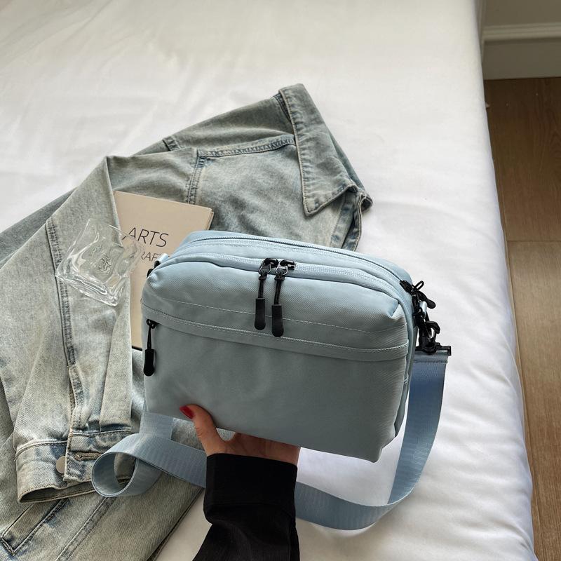 Mobile phone bag simple trend 2025 summer new Japanese lightweight shoulder small backpack women's leisure sports messenger bag