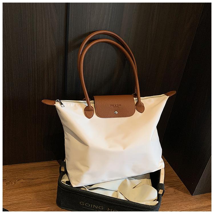 

2025 spring dumpling bag tote bag versatile women s handbag shoulder messenger bag commuter women s bag large capacity bag