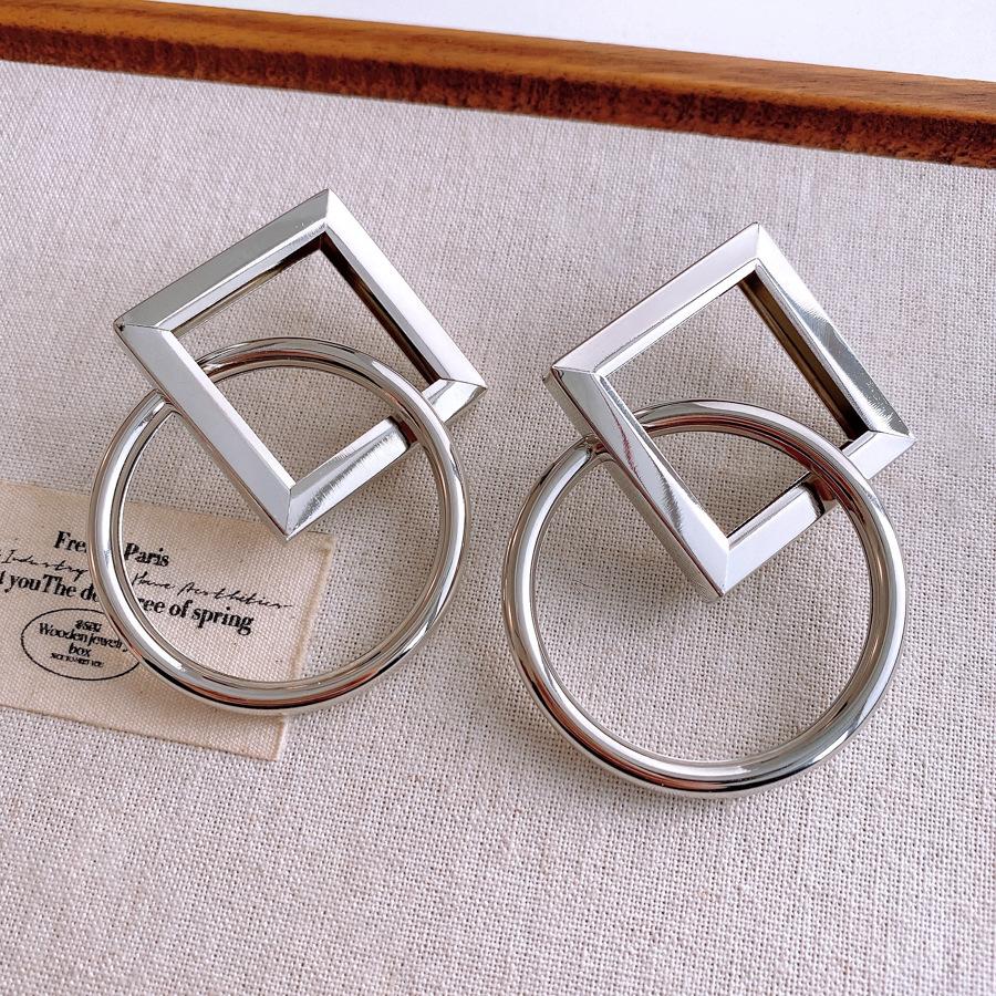 

Silver Needle Rhombus Round Hollow Earrings European and American Cold Wind Stud Earrings Exaggerated Design Earrings Female Niche