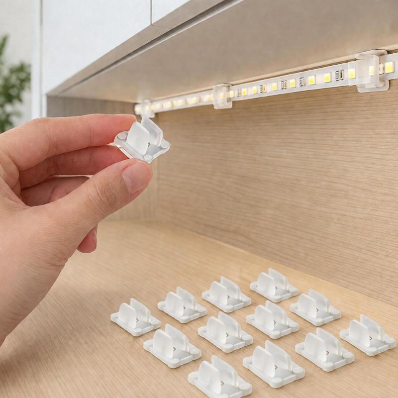 Clear LED Tape Fasteners, Plastic LED Ribbon Holders, with Two Opposing Prongs and Flat Mounting Bases for Direct Placement and Organized Routing