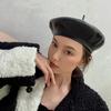 Béret en cuir PU noir mode féminine rétro mode étrangère Chapeau bouton britannique automne et hiver Chapeau d'influenceur Internet peintre