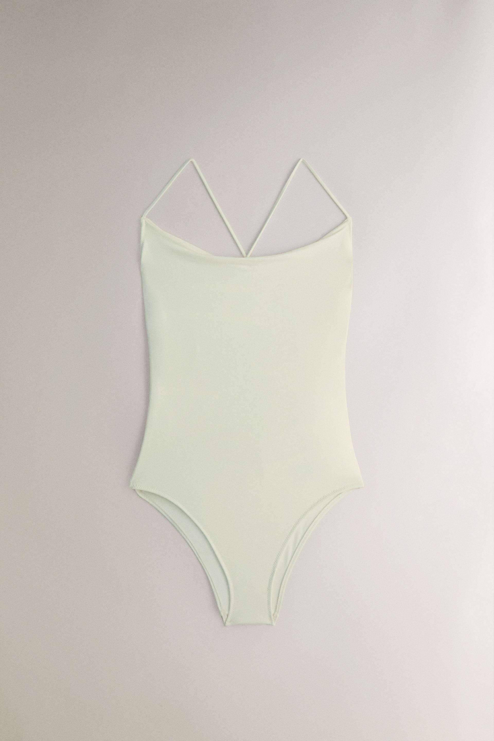 

ПЛЯЖНЫЙ КУПАЛЬНИК С ДРАПИРОВАННЫМИ ДЕТАЛЯМИ