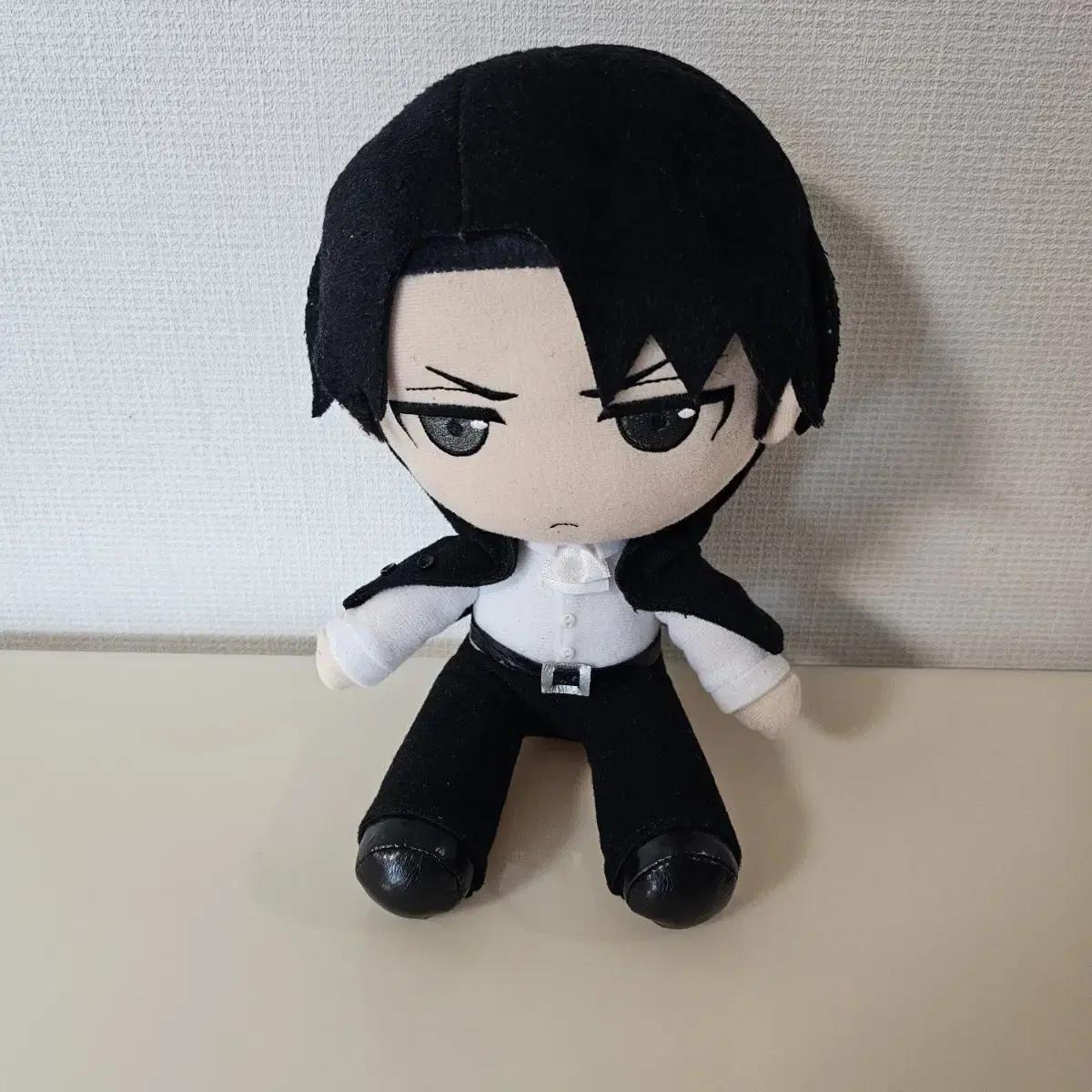 

A Doll With An Attack On Titan Levi Suit Jacket On Her Shoulder
