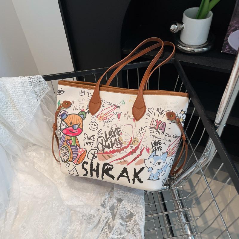 Cute new autumn large-capacity cartoon graffiti print going out fashionable versatile shoulder handbag