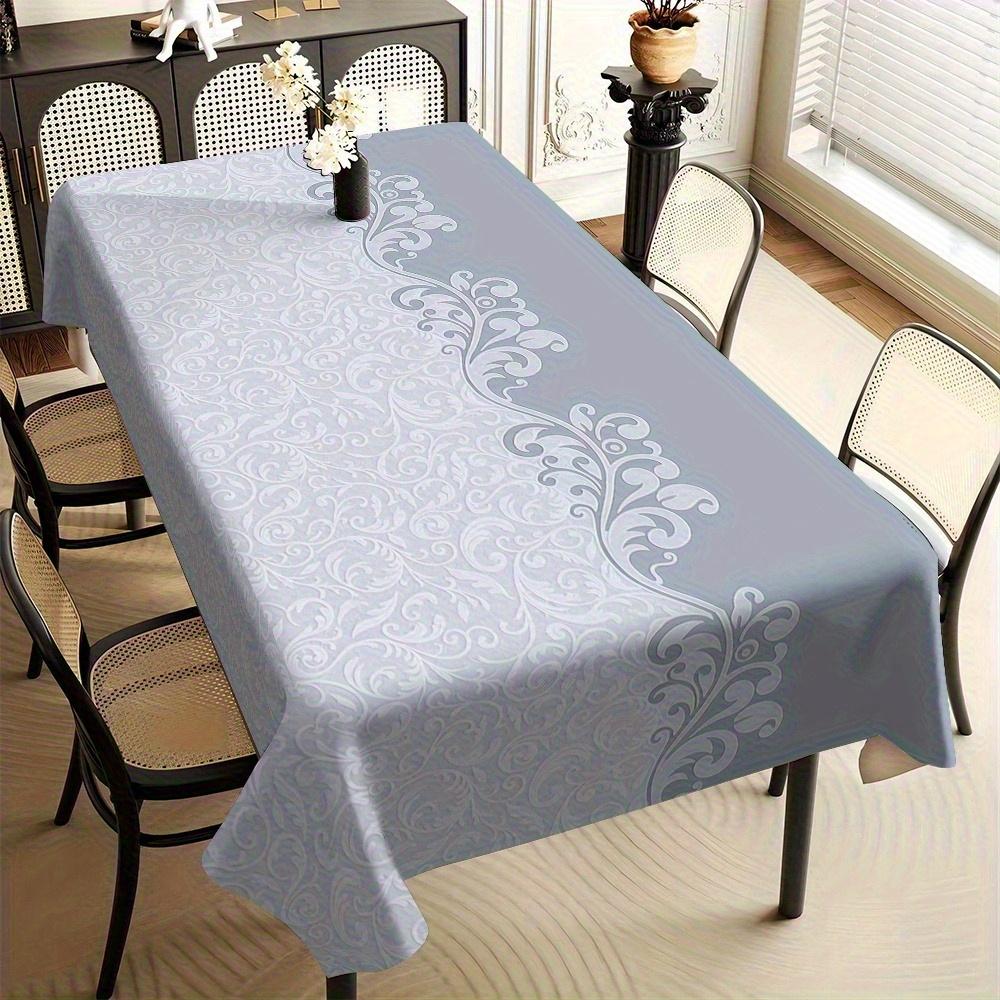 One modern-style tablecloth in light blue, gray and white patterns, made of rectangular durable polyester fabric.