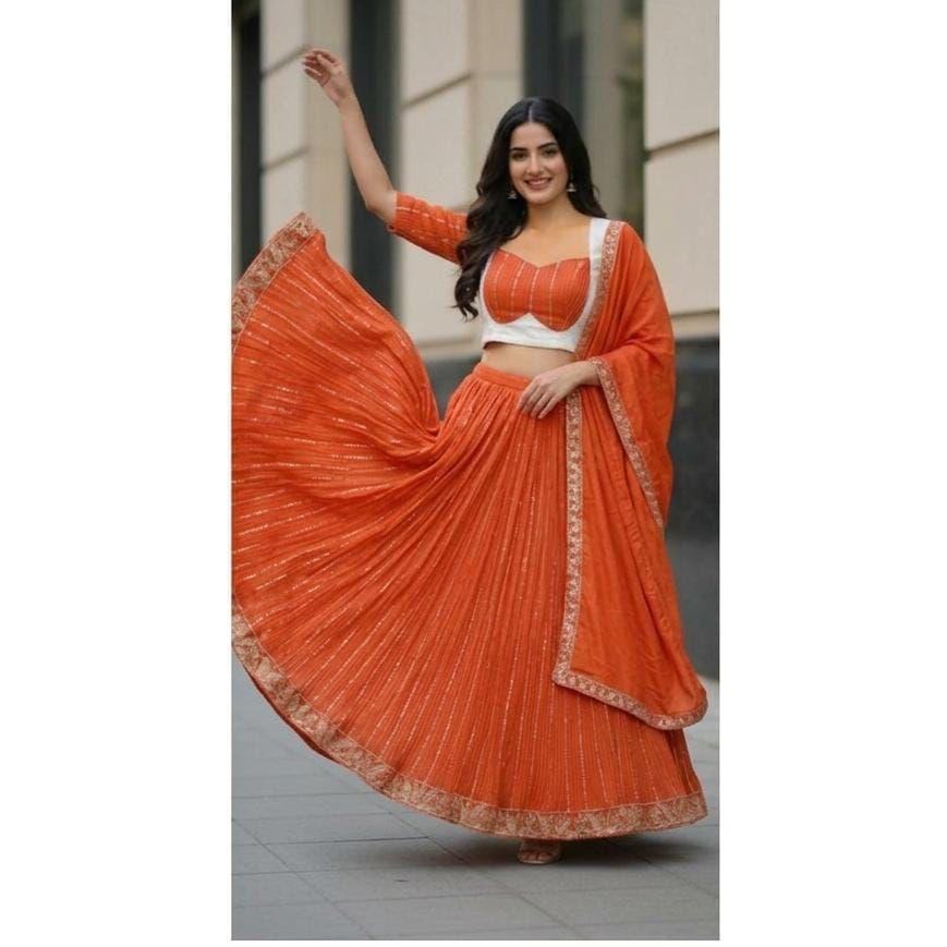 Lehenga Choli Presentiamo un lehenga in chiffon perfettamente miscelato per la stagione festiva per incantare il tuo look collezione 2026