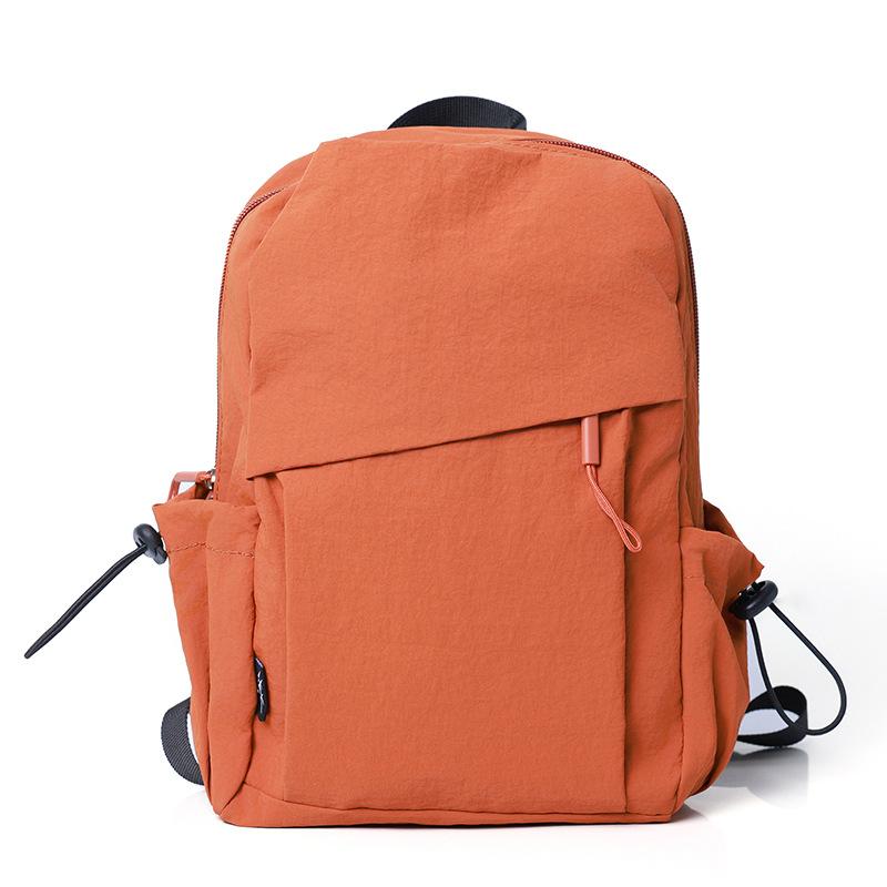 

New women s high-end backpack men s large-capacity shoulder messenger bag outdoor lightweight mountaineering backpack помаранчевий