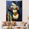 Tattooed woman in bold patterned swimwear with decorative surroundings. Patterned tapestry for bedroom and living room home decor