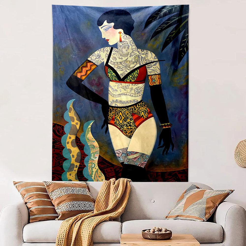 Tattooed woman in bold patterned swimwear with decorative surroundings. Patterned tapestry for bedroom and living room home decor