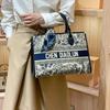 Trendy Embroidered Handheld Tote Bag for Women's New Autumn/Winter Large Capacity High End Feeling Morning Commuter Bag