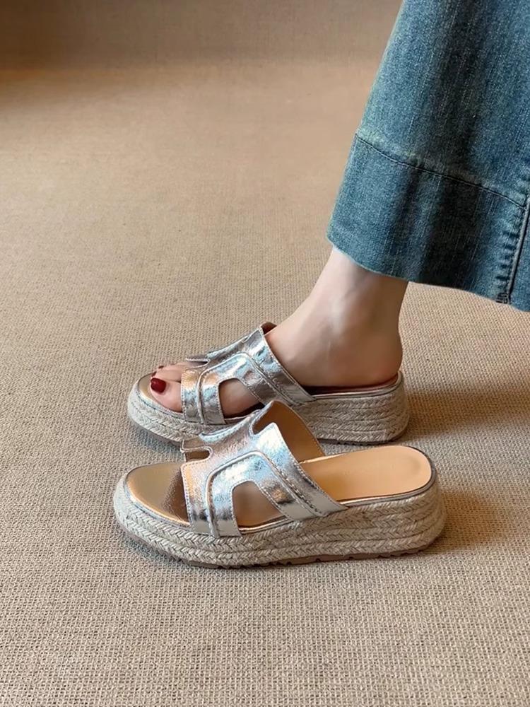 

Zhao Ruth has the same one-word French wedge heel thick-soled cool slippers for women s 2025 new summer straw Roman sandals 40