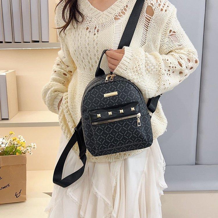 Schoolbag fashion PU travel small backpack storage Korean version lady temperament rivet small backpack trend small backpack
