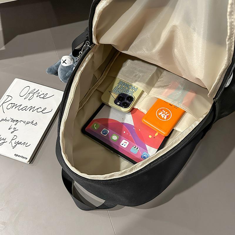 College student schoolbag is simple and large-capacity, junior high school student travel backpack, trendy and casual backpack, student schoolbag.