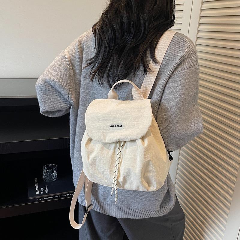 

2026 New Four Seasons Pass Versatile Casual Fashion Simple Letter Contrasting Color Drawstring Women s Backpack 26CMX26CMX12CM