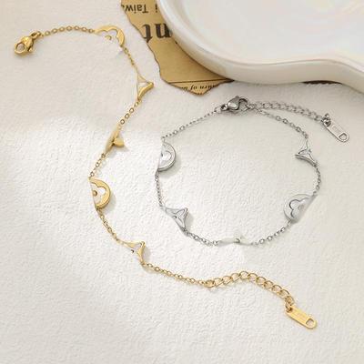 Exquisites vierblättriges Kleeblatt Weißes Muschel Titanstahl Armband - Eleganter und luxuriöser Damenschmuck