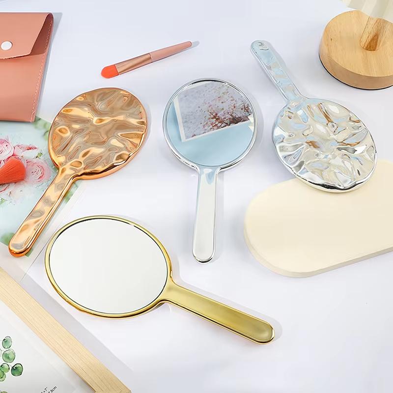 Flüssige Ellipsoidform Spiegel Handgehalten Desktop Kosmetik Make-up Spiegel Reise Tragbar Schönheit Glänzend Silber Spiegel für Handtasche