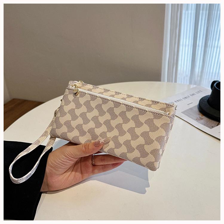 

Fashion texture mobile phone bag women s bag new retro printing dinner bag clutch bag high-end niche change bag tide