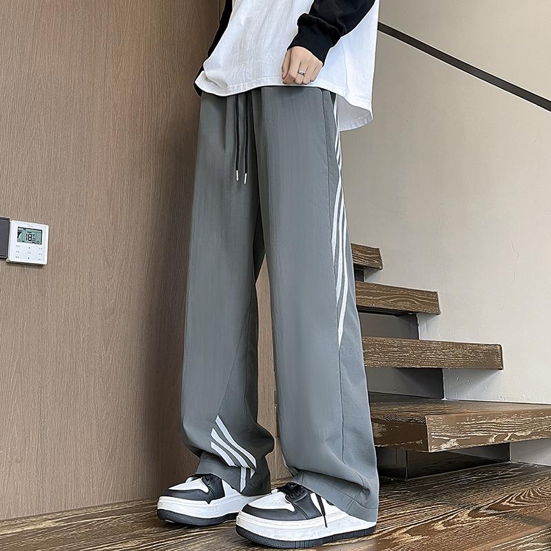 Qiuxin new design sense three bars outdoor paratrooper pants men's straight long pants casual pants one piece shop