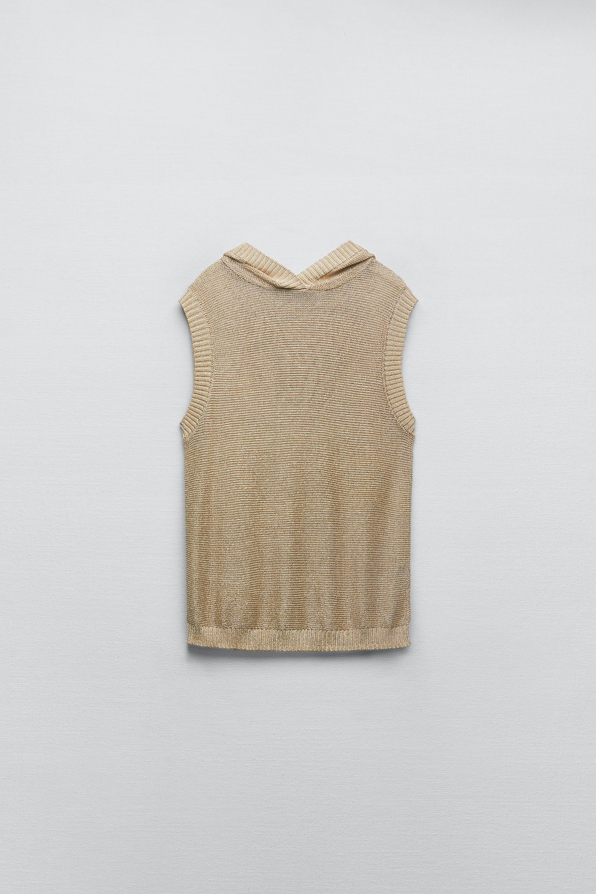 

ТРИКОТАЖНЫЙ ТОП С КАПЮШОНОМ МЕТАЛЛИЧЕСКОЙ НИТЬЮ