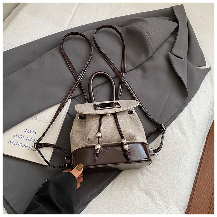 

Korean version of retro college style backpack for women 2025 new contrasting color niche portable bucket bag single shoulder backpack for women
