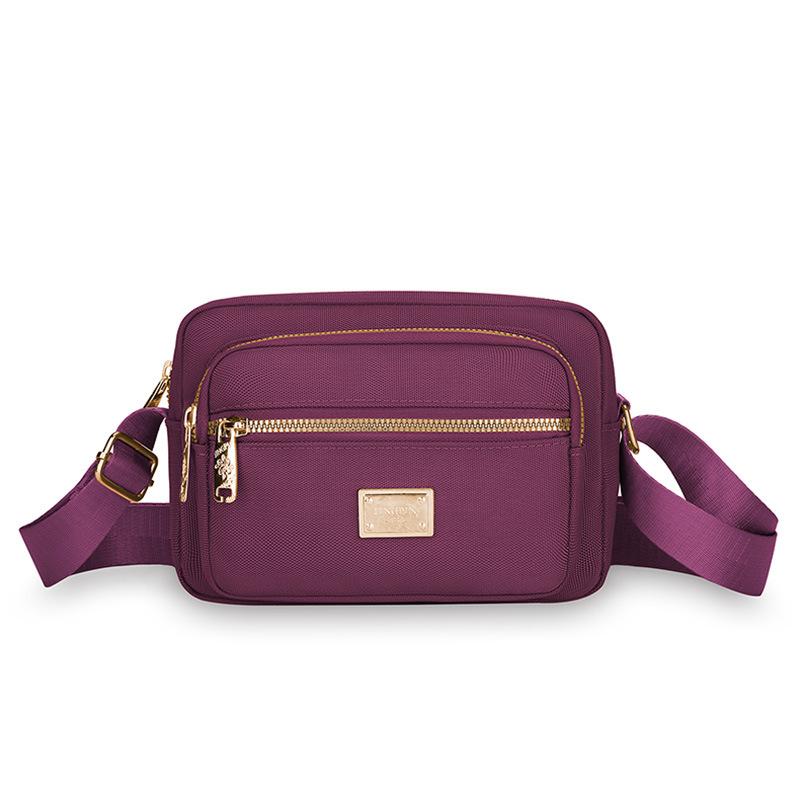 New Portable Oxford Cloth Mother Bag Fashion Simple Multi Layer Middle Aged Shoulder Bag Atmosphere Joker Slung Small Bag.