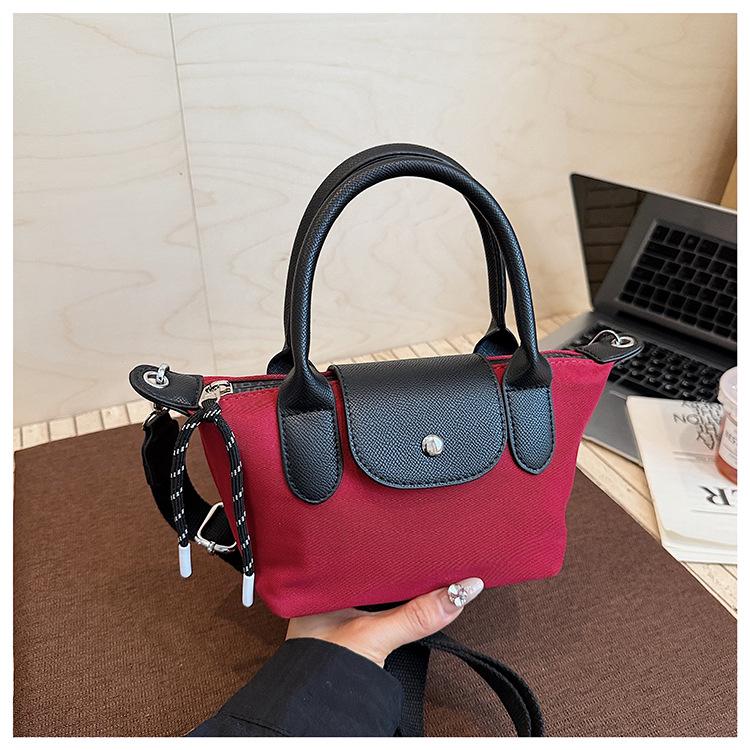 Minimalist Color-Block Oxford Cloth Handbag: Versatile, Fashionable Shoulder Bag with Unique Texture.