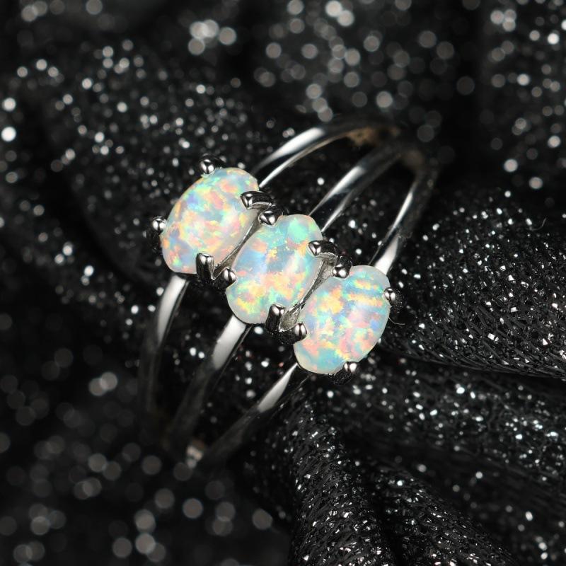 Hot-selling three-layer four-claw inlaid Opal OPal ring temperament simple personality unique ring