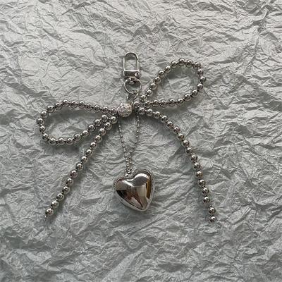 Pendentif de Sac Cœur Nœud Papillon Perlé Argenté Décoration Sac à Main Sac à Dos Pour Accessoires de Sacs