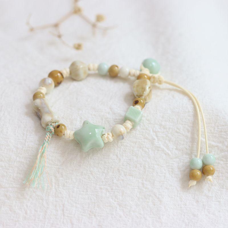 

Yinju Artsy Свежий Плетеный вручную Керамический шнурок с кисточкой Цзиндэчжэнь XINGX Фарфор Розовые бусины Браслет 528 XINGX Green