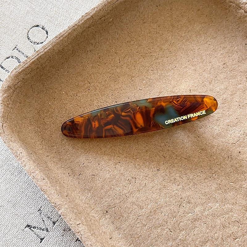 

Korean version of the texture willow leaf acetic acid one-word clip duck bill clip gold letter printing girl side bangs clip hair