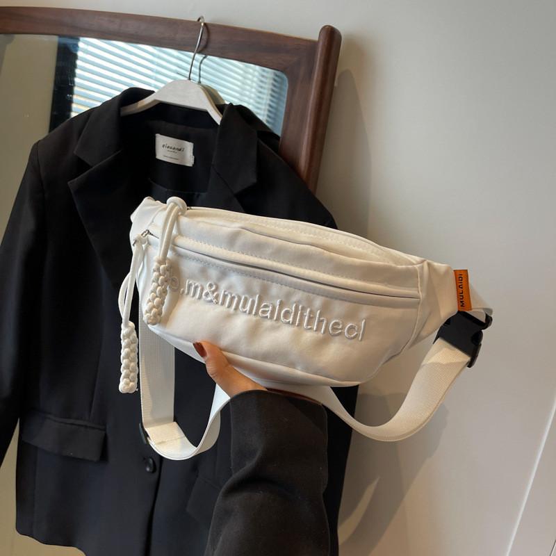 Versatile Water-resistant Canvas Crossbody Bag With Letter Print Perfect For Travel And Casual Use