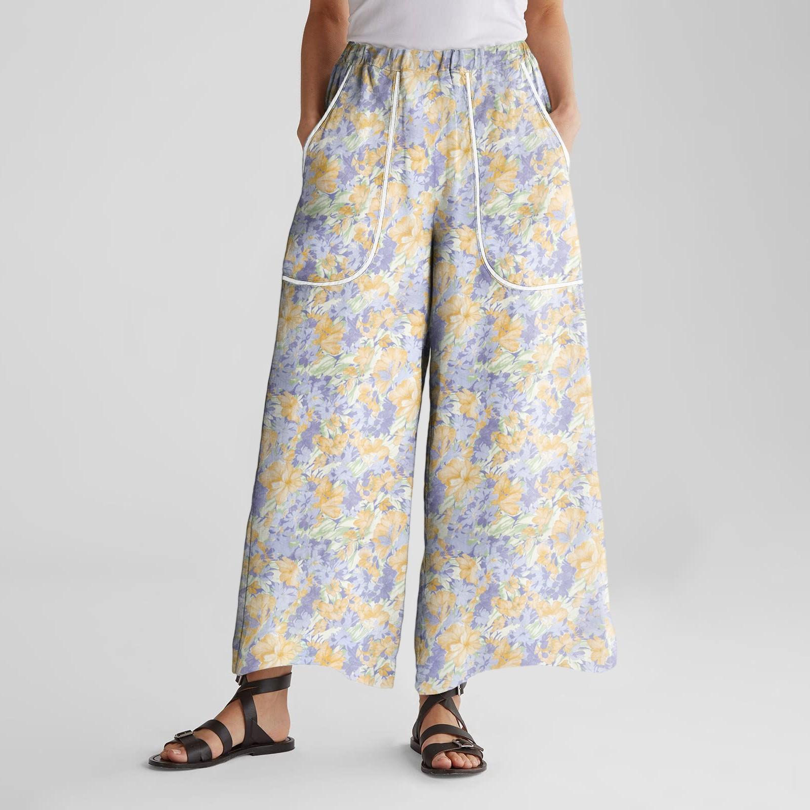 

Женские брюки широкие от бедра с эластичным поясом, с принтом, с большими карманами, с отделкой пэчворк по краю, свободные XL жёлтый