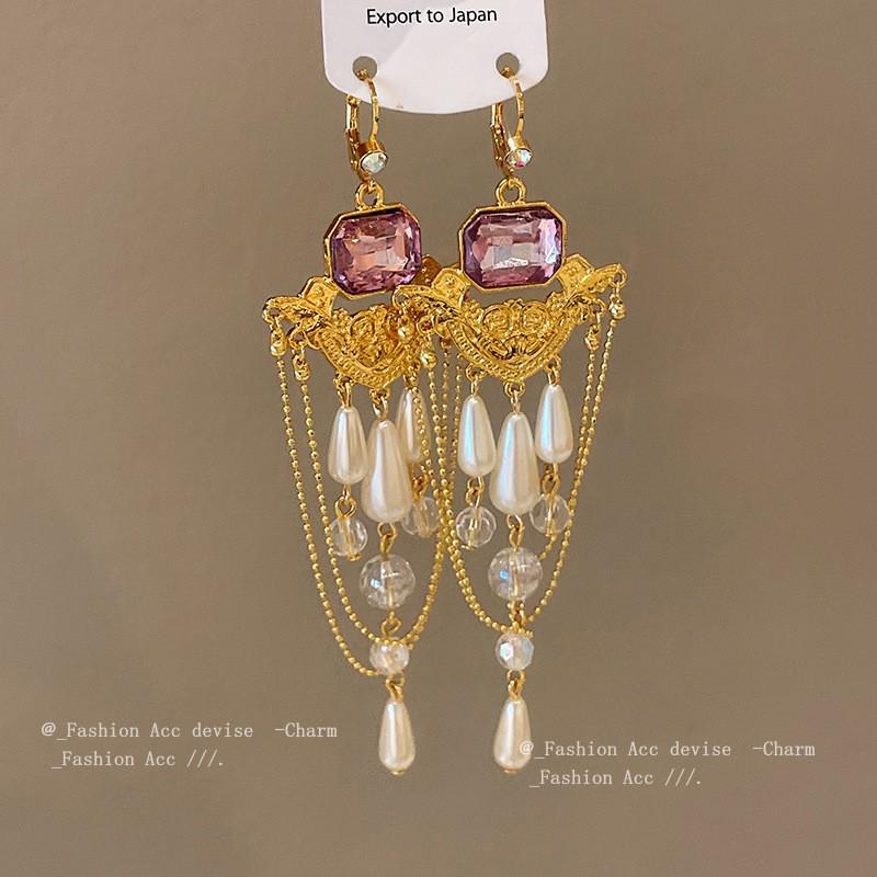 Vintage Quastenohrringe aus Silbernadel: Elegantes Wassertropfendesign mit einem Retro-literarischen Touch