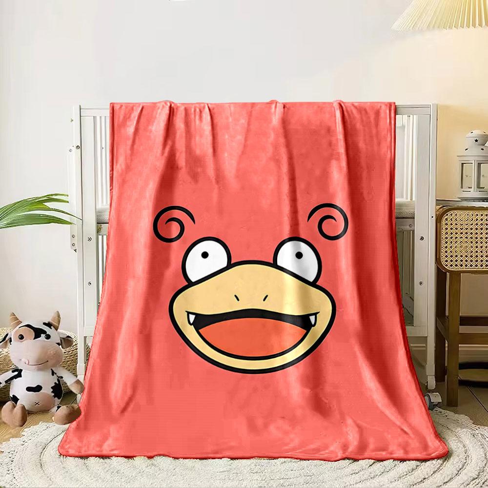 

A cartoon face with swirly ears, wide eyes, and an open smiling mouth. for all seasons blanket lunch break throw gift 80cm x 120cm