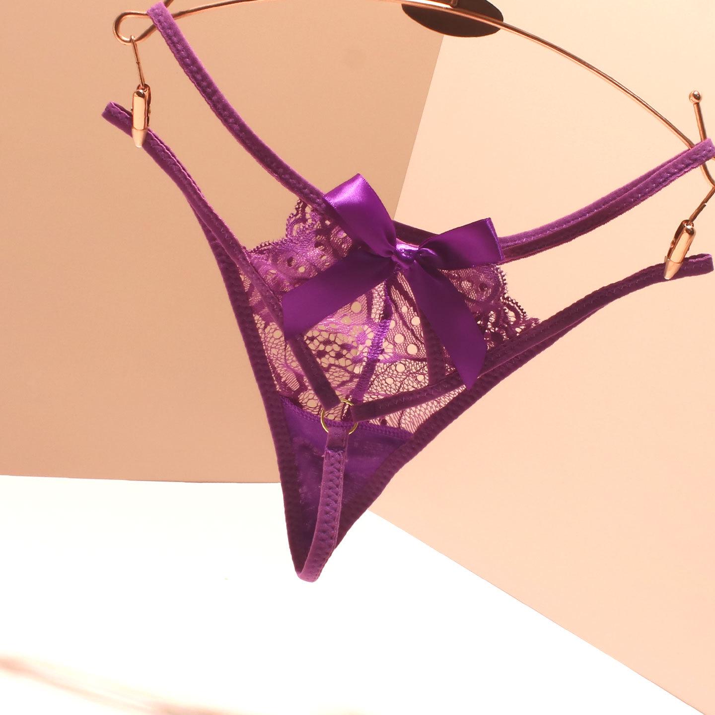 

Безшовні жіночі трусики Т-спинка з мереживною обробкою та бантиком One Size фіолетовий